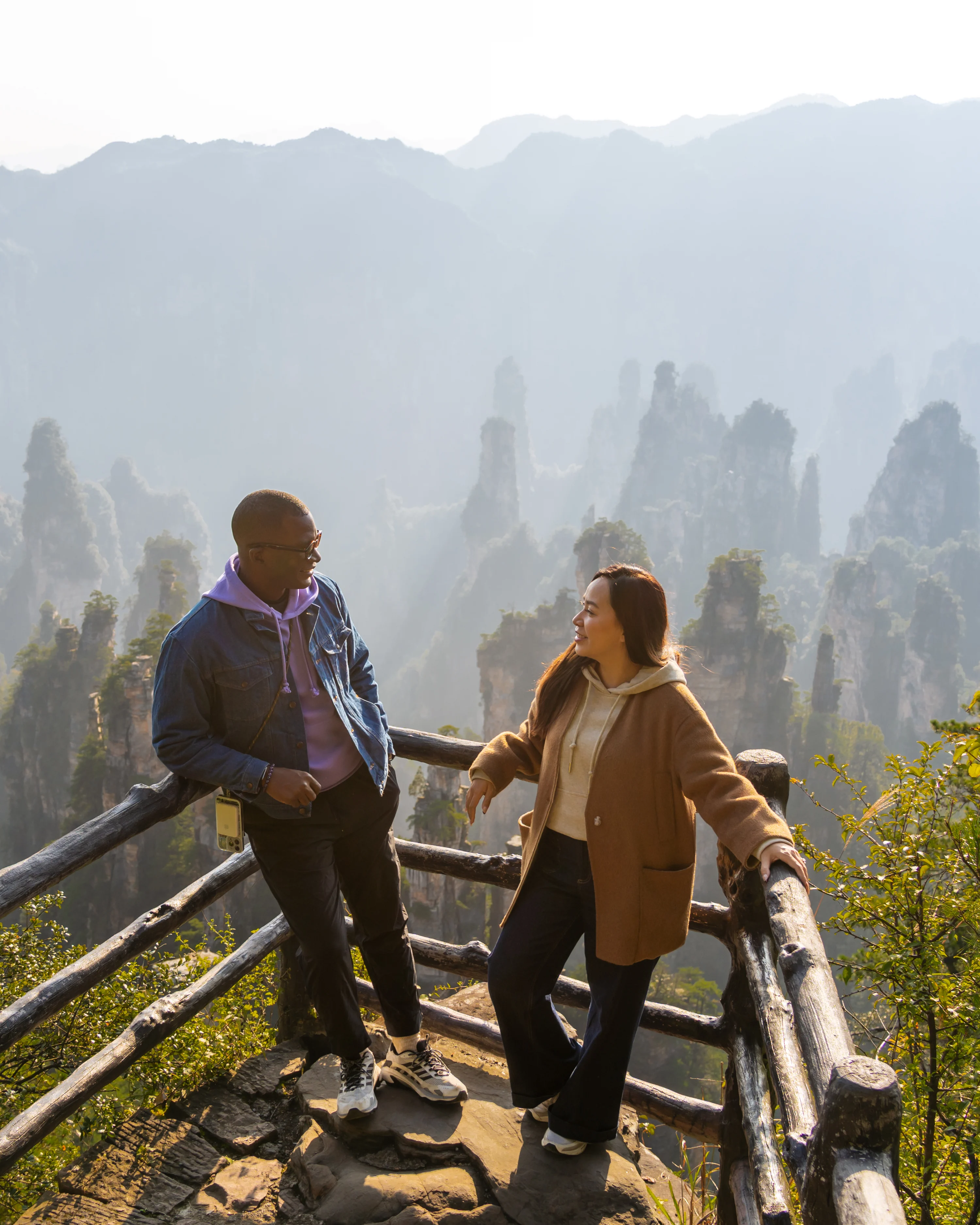 Couple looking at view of Zhangjiajie, China